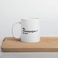 Mug blanc « du champagne ? for sure. », sur une planche en bois