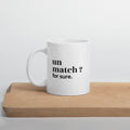Mug blanc « un match ? for sure. », sur une planche en bois